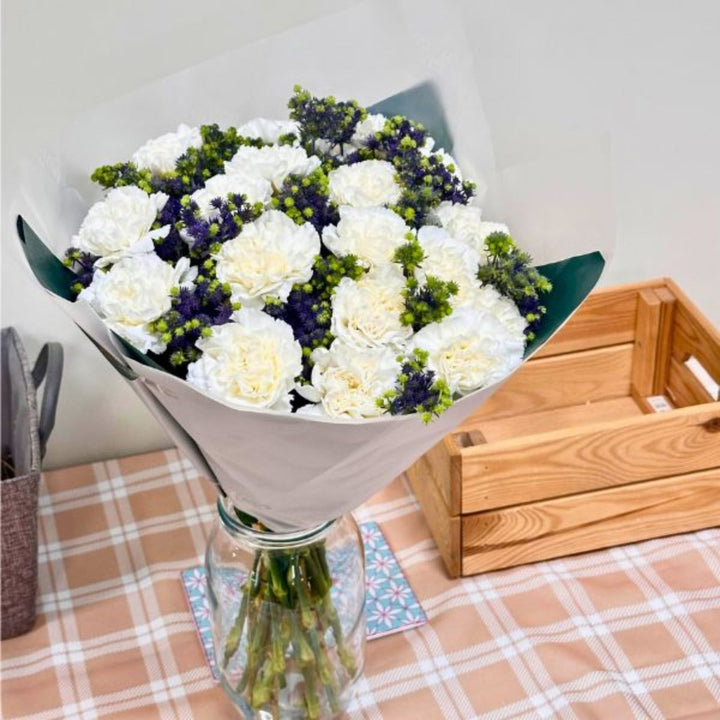 Mix Flower Bouquet with 30 stems of vibrant carnations and eryngium, arranged in a colorful floral bouquet.