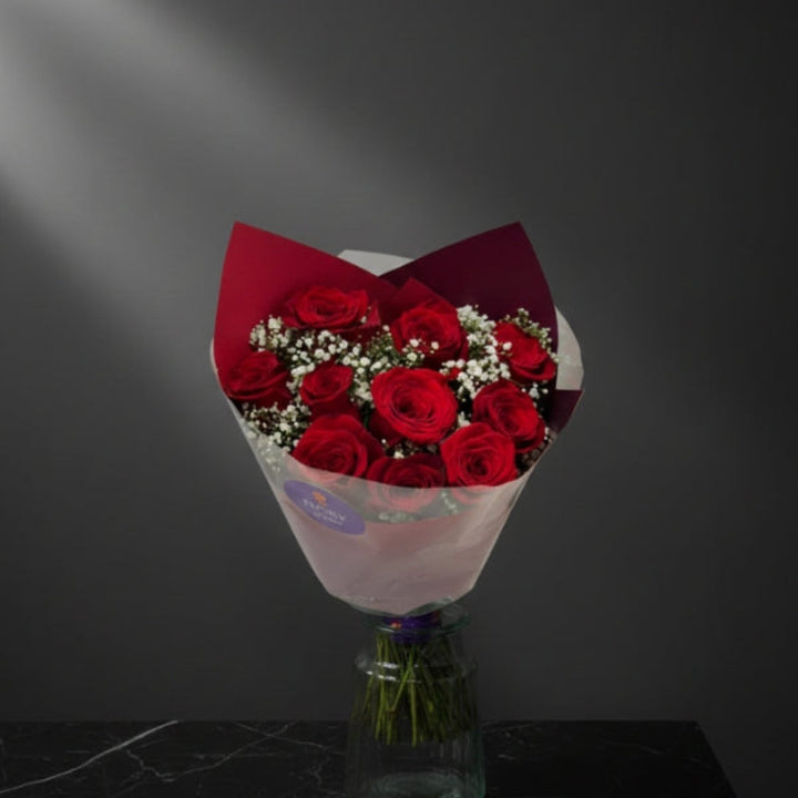 Red Roses Classic Bouquet with 12 stems in a Mix Flower Bouquet, showcasing vibrant red roses arranged in a lush floral display.